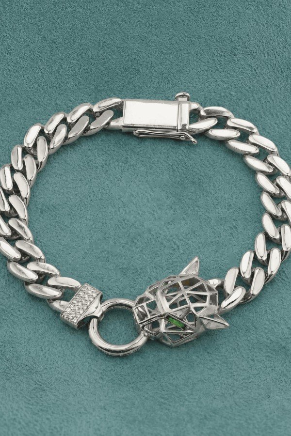 Браслет из белого золота c бриллиантами и изумрудом